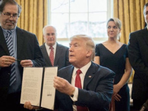 https://www.ajot.com/images/uploads/article/653-trump-signed-order.jpg