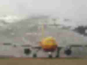 https://www.ajot.com/images/uploads/article/660-dhl-plane-landing.jpg