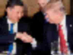 https://www.ajot.com/images/uploads/article/Donald-Trump-Xi-Jinping-handshake-Florida.jpeg