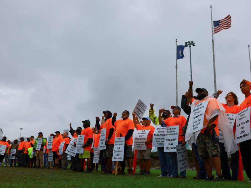 Biden says sees progress in US port labor dispute as strike enters third day