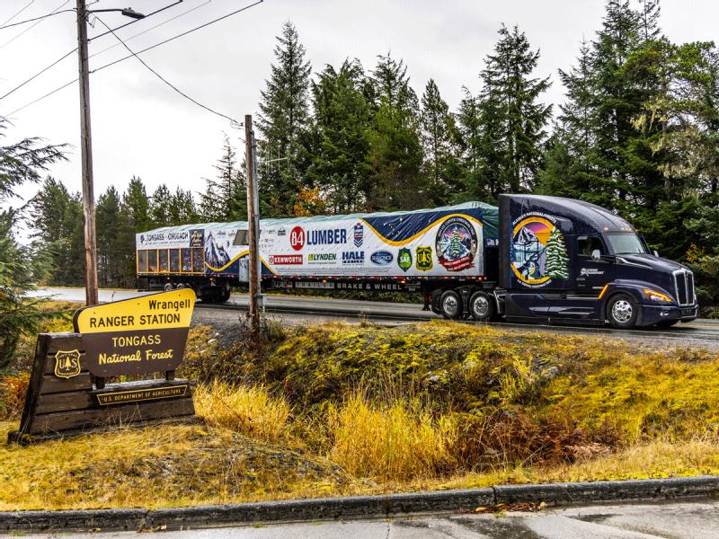 Truck drivers with 10 million miles of safe driving moving Christmas trees from Alaska to Washington, D.C.