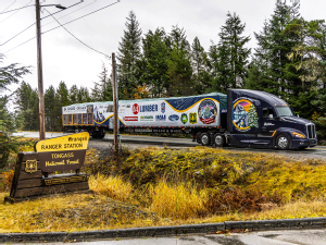 Truck drivers with 10 million miles of safe driving moving Christmas tree from Alaska to Washington, D.C.