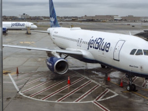 https://www.ajot.com/images/uploads/article/a-jetblue-airways-corp-aircraft-sits-at-a-gate-in-terminal-5-at-john-f-kennedy-international-airport-jfk-in-new-york.jpg