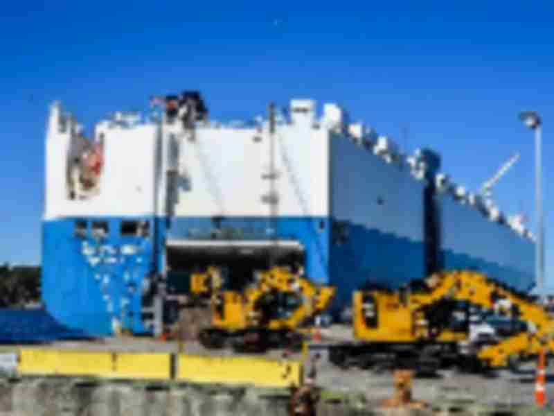 Dozens of massive Caterpillar excavators move through JAXPORT