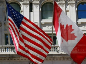 https://www.ajot.com/images/uploads/article/canada-u-s-relations-north-america-canadian-flag-u-s-flag.jpg