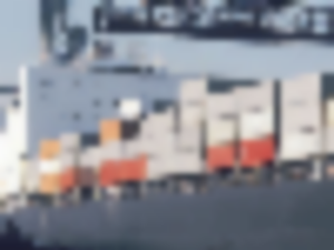 https://www.ajot.com/images/uploads/article/generic-containership-in-port.png