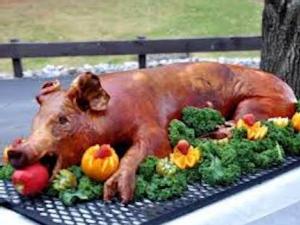 https://www.ajot.com/images/uploads/article/pig-roast.jpeg