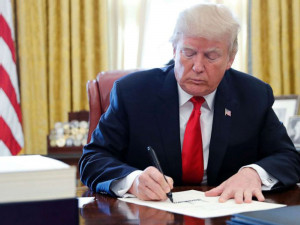 https://www.ajot.com/images/uploads/article/trump-signing-law.jpg