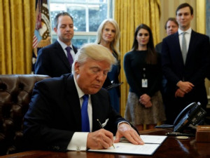 https://www.ajot.com/images/uploads/article/trump-signs-bill-tax-reform.jpg