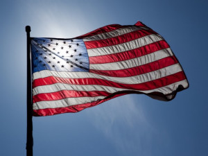 https://www.ajot.com/images/uploads/article/us-flag-backlit-sun.jpg