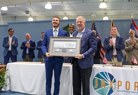 JAXPORT Chairman Jamie Shelton (Right) presents a gift to Puerto Rico Ports Authority Executive Director Joel A. Pizá Batiz during Monday's MOU signing ceremony.