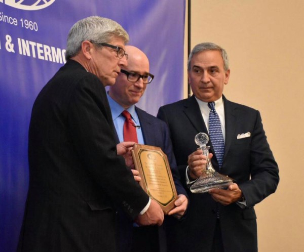 2017 Connie Award recipient, Brad Jacobs (center), CEO, XPO Logistics, is congratulated by Michael DiVirgilio (far left), President, CII, and Jim Newsome (far right), President and CEO of South Carolina State Ports Authority and previous Connie Award recipient.