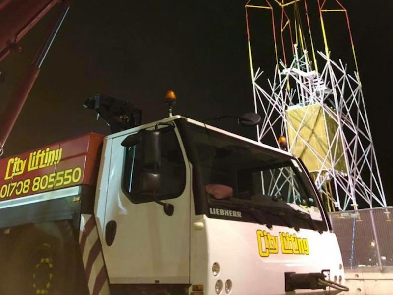 The complexity of the below-the-hook rig is evident as one of four tower sections is lifted into place at London City Airport.