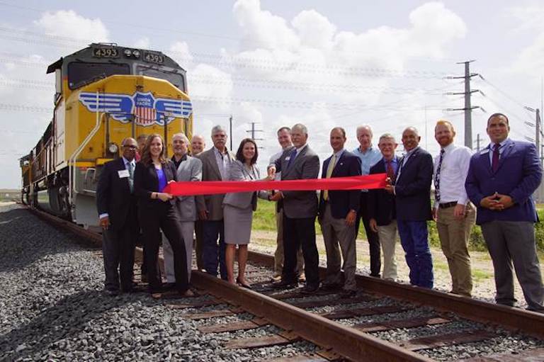  Representatives from Port Freeport Commission, Executive Staff, Congressman Randy Weber’s Office, Congressman Pete Olson’s Office, U.S. Army Corps of Engineers, and Union Pacific cut the ribbon to officially open Phase 1 of the Parcel 14 Rail Development. Union Pacific locomotive was off and staged for photography purposes only.