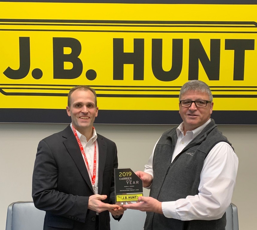 Miller accepted the award from Kevin Housley, LTL carrier relations manager for J.B. Hunt in November 2019.