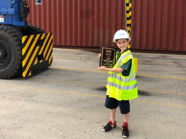 Jack Sibley-Jones, a fifth grader at Blythe Academy, visits Inland Port Greer to see the rubber-tired gantry crane he named “South Craneolina