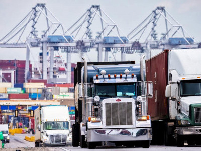 https://www.ajot.com/images/uploads/article/Trucks-at-port.jpg