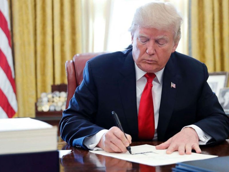 https://www.ajot.com/images/uploads/article/trump-signing-law.jpg