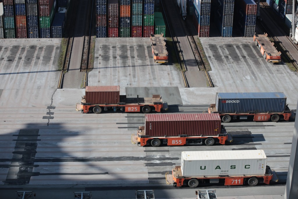 Automated Guided Vehicles carrying containers at Port of Rotterdam