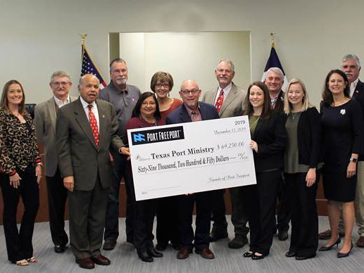 Port commission and staff presents check to Bobby Fuller, Director of Texas Port Ministry.