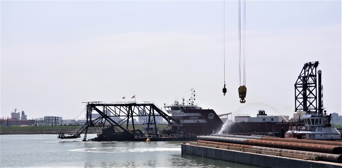 The Dredge Carolina cutterhead is lowered into the Freeport Harbor Channel