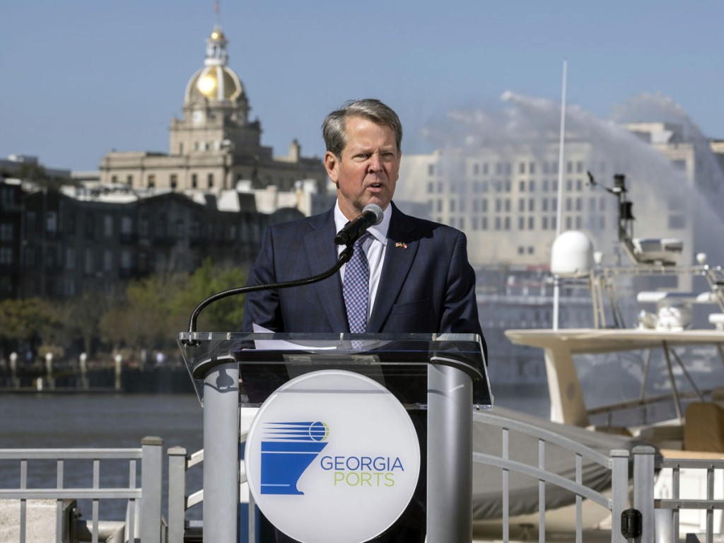 Georgia Gov. Brian Kemp speaks at a ceremony marking completion of the Savannah Harbor deepening, Friday, March 25, 2022, in Savannah, Ga. Deepening the Savannah Harbor to 47 feet at mean low water (the average depth at low tide), provides ample draft for vessels carrying 16,000+ twenty-foot equivalent container units, allowing ships to transit the river with more containers each trip and during more hours of the day. (GPA Photo/Stephen B. Morton)