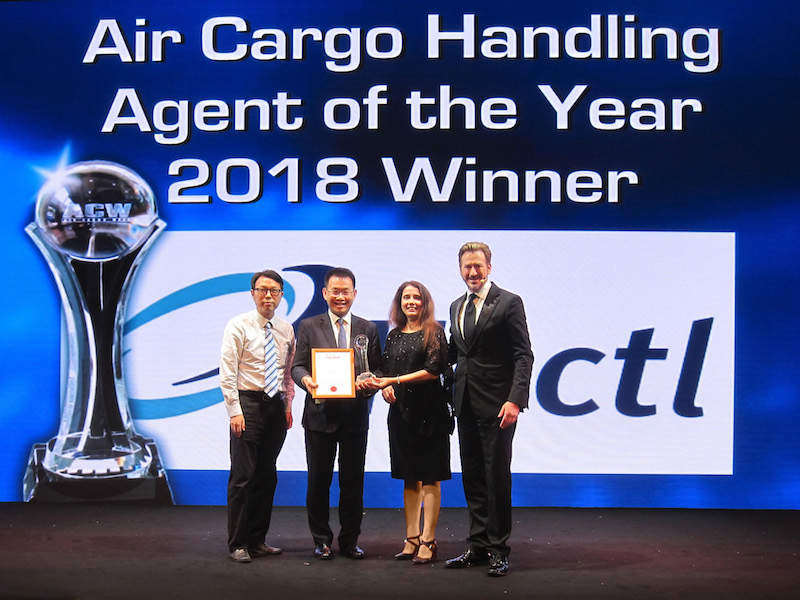 Hactl Chief Executive Wilson Kwong (second from left) receives the award.