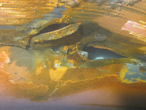 Cracks and punctures in the flat bottom shell platting of the tanker