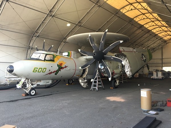 Damaged aircraft prior to being shrink wrapped. The Northrop Grumman E-2 Hawkeye is an all-weather, carrier-capable tactical airborne early warning aircraft. (PRNewsFoto/Mr. Shrinkwrap)