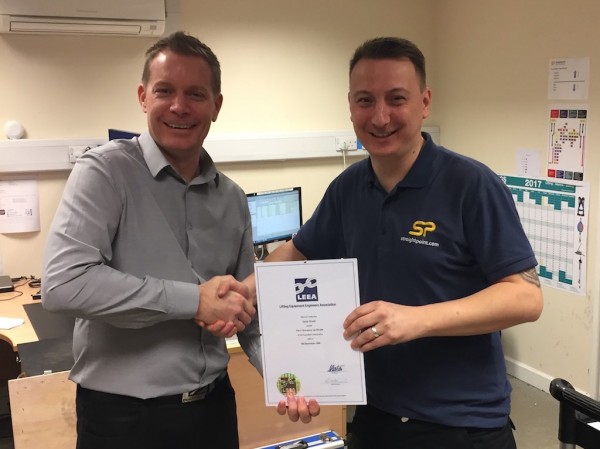 SP’s Alfie Lee (left), operations director, presents Gavin Arnell, product technician, with a LEEA certificate.